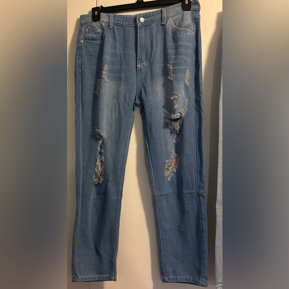 3 pair of brand new women’s distressed jeans.